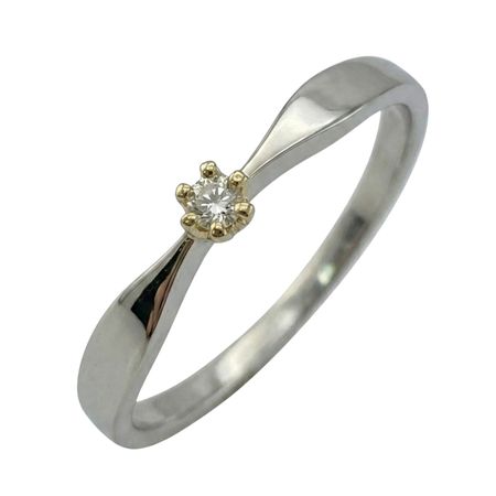 Pierścionek z białego złota z brylantem o masie 0,04 ct oraz wadze 1,38g